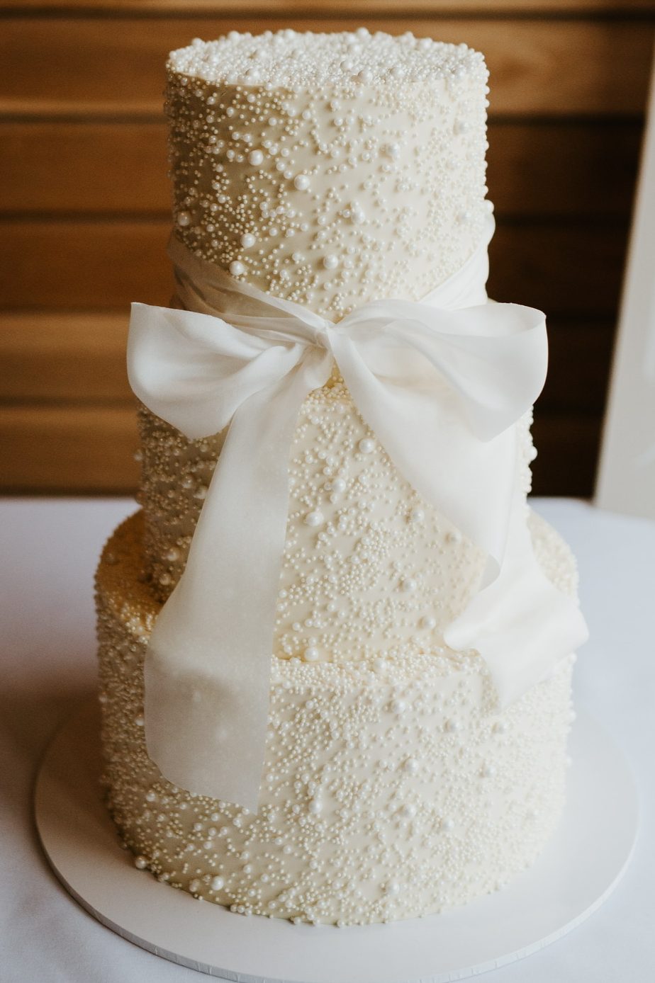 Wedding cake Shotesham Park Norwich Norfolk, bow with pearls