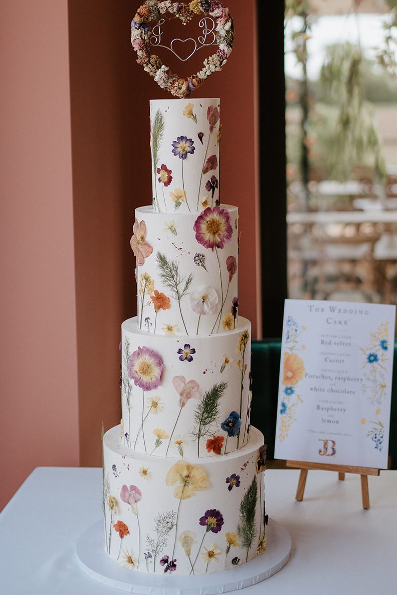 Four tier pressed edible flower cake Suffolk.